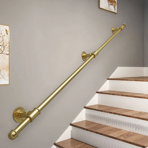 Heavy Duty Adjustable Round Tube Railing Kit For Decks And Stairs mounted on a wall beside wooden stairs.