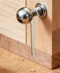 Close-up of Xuanqiu Quick Release Pin attached to wood, showcasing sturdy alloy construction for secure locking.