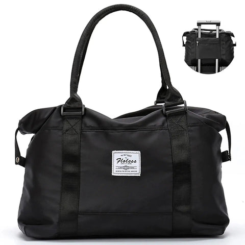 Black versatile travel gym bag for women with wet pocket, carry on duffle tote luggage for gym weekender and overnight trips, front view.