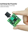 Low Voltage PWM DC Motor Speed Controller 1.8V To 12V 2A 24W Adjustable Driver Switch held between fingers showing circuit board details