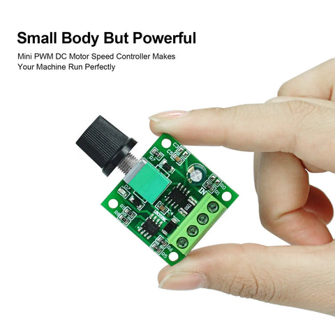 Low Voltage PWM DC Motor Speed Controller 1.8V To 12V 2A 24W Adjustable Driver Switch held between fingers showing circuit board details