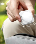 Person holding Rechargeable Tent Lights 2 Pack Portable LED Camping Lanterns beside a bag, highlighting compact size.