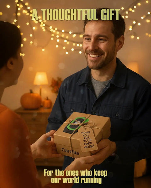 Person smiling and handing a decorated gift box labeled Carelite, with string lights and pumpkins in the background.