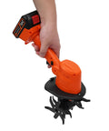 Cordless Mini Tiller With Five 1500mAh Batteries And Fast Charger, 235RPM Handheld Cultivator in hand, displaying orange design