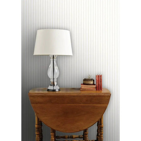 Premium PVC Free Type II Professional Wallpaper Featuring Matte Linen Texture Hella Durable Finish Zero Hassle Paste To Paper Install For Kitchens And Bathrooms Real Deal Quality on a textured wall with a lamp and books.