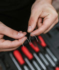Hands holding silver staples from the 100 Piece Car Bumper Repair Welder Staples Kit For Plastic And Auto Body Fixes Versatile Welding Staples For Patching Bumpers And Other Plastics Durable Metal Silver Finish Easy On The Go Auto Body Repairs