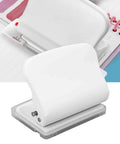 Manual 10 Hole Punch for Loose Leaf Paper A4 to A6 and B5 Sizes, 10 Sheets Capacity, shown on desk with notes.