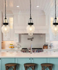 Black Kitchen Island Pendant Light With Adjustable Height From 22 To 56 Inches, Glass Shade in modern kitchen setting
