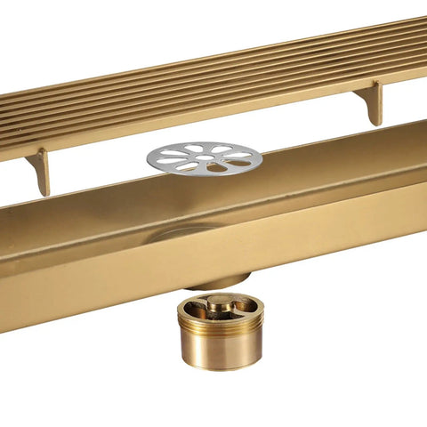Straight Up The Best Slick Brushed Gold Linear Shower Drain With Badass 304 Stainless Steel Construction And Integrated Hair Catcher For Lightning Fast High Flow Drainage In Any Modern Home Setup Today, showing linear design with hair catcher.