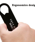 Close-up of hand holding 1911 Barrel Bushing Wrench Black Anodized Aluminum Handle with Black Oxide Finish multitool