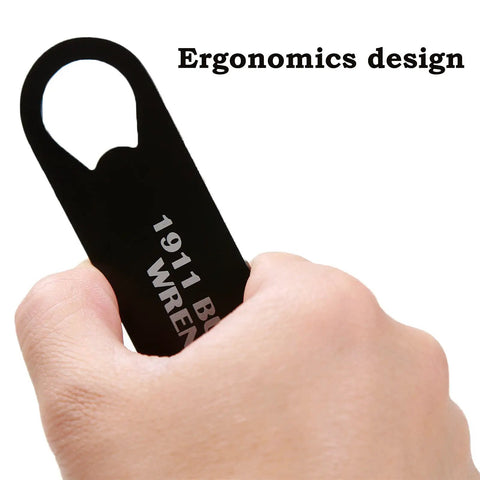 Close-up of hand holding 1911 Barrel Bushing Wrench Black Anodized Aluminum Handle with Black Oxide Finish multitool