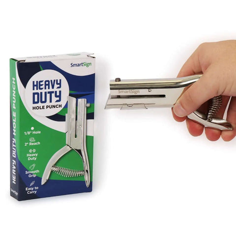 Heavy Duty Handheld Workhorse Single Hole Punch With 1/8 Inch Punch And 2 Inch Reach next to packaging