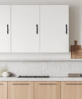 8 Piece Black Tree Branch Cabinet Handles Set installed on white kitchen cabinets, natural twig design drawer pulls, zinc alloy, rust resistant.