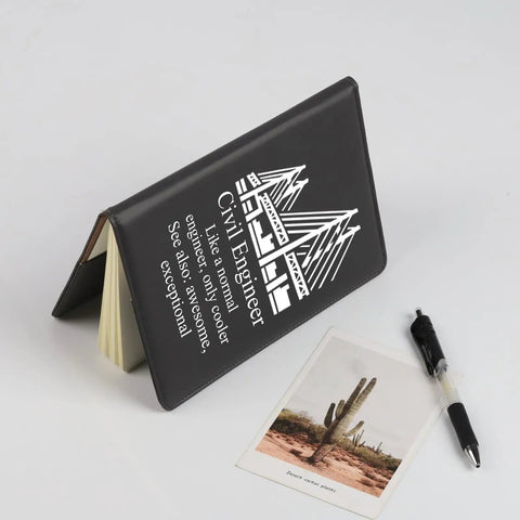 Civil Engineer Notebook For Students And Pros A Funny Engineering Gifts Journal with black leather cover on desk