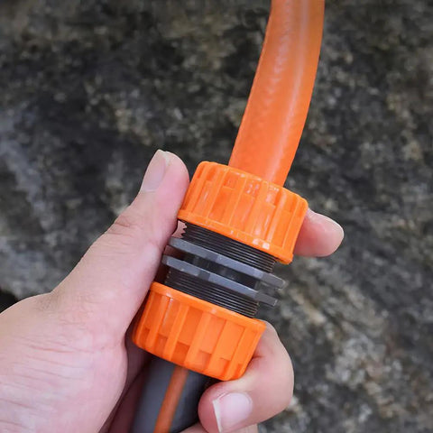 Garden Hose Repair Kit For 1/2 Inch Hoses, Quick Connect Connectors held showing Leak Proof Easy Install.