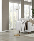 Tall Floor Lamp With Glass Mushroom Shade In Brass And White Milk Glass, Handcrafted Steel Base in a living room
