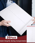 Person holding 50 Pack Bulk Large Rigid Mailers 13 x 17.75 Inch Self Seal Cardboard Envelopes Stay Flat White Kraft