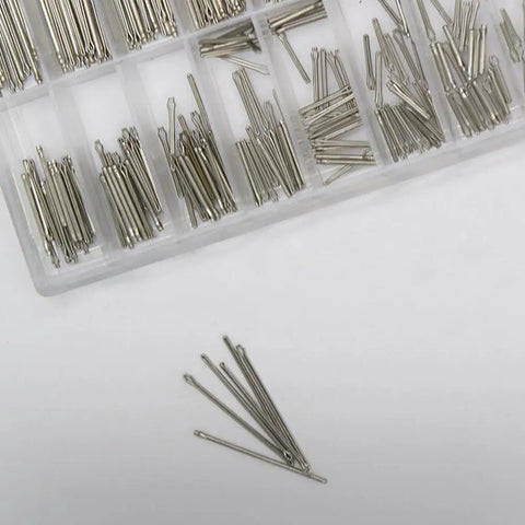 Slick Watch Repair Kit With Heavy Duty Stainless Steel Spring Bars and Precision Pin Remover Tool for fast adjustments, showing assorted stainless steel spring bars.