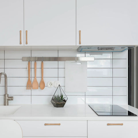 Modern kitchen with 10 Pack 5 Inch Champagne Bronze Cabinet Handles For Kitchen Cabinets And Furniture Pulls installed on white cabinets.