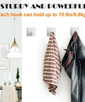 Heavy Duty Adhesive Towel Hooks 4 Pack Stainless Steel Self Adhesive Wall Hangers installed in home holding clothes