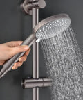 Hand holding J350 BN Brushed Nickel Retrofit Shower System with 3 Function Handheld Showerhead Kit spraying water.