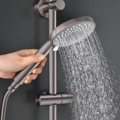 Hand holding J350 BN Brushed Nickel Retrofit Shower System with 3 Function Handheld Showerhead Kit spraying water.