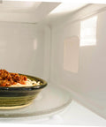 Interior view of a microwave with a 10Pcs Microwave Oven Mica Sheet For Heat Resistance And Insulation on the right wall.