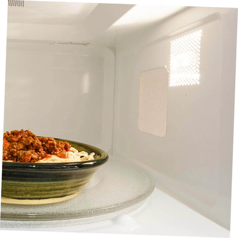 Interior view of a microwave with a 10Pcs Microwave Oven Mica Sheet For Heat Resistance And Insulation on the right wall.