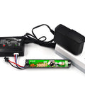 2-Pack Beefed-Up 11.1V 2000mAh Li-Ion Battery Pack With 30C Discharge For RC Cars Boats Drones And Hobby Shooting Devices Includes SM-2P Plug And Balance Charger next to charger and outlet