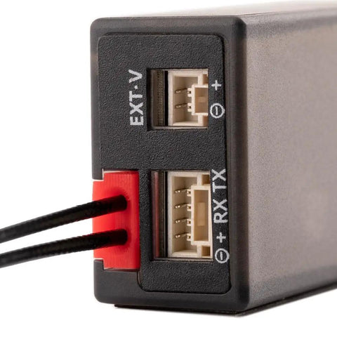 Close-up of ER6 2.4G 6CH PWM Receiver For Fixed Wing RC Planes With CRSF And ExpressLRS showing ports and wiring connection details.
