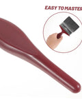 Workhorse Pro Grade Deck Stain Brush large paddle brush with ergonomic red handle shown with easy grip demonstration