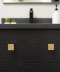 Front view of cabinet with Cullet Square Knob Chrome 7 Pack One And Three Eighths Inch Wide Modern Hardware in gold finish.