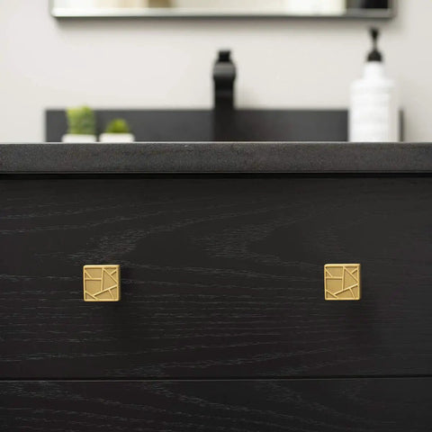 Front view of cabinet with Cullet Square Knob Chrome 7 Pack One And Three Eighths Inch Wide Modern Hardware in gold finish.