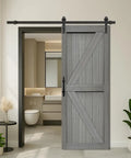 Top Tier Sliding Barn Door Measures 32 By 84 Inches In Striking Elephant Gray Solid Mdf Panel with a black track in a modern interior.