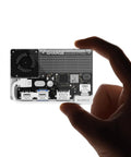 Hand holding All In One Portable 1TB SSD With Active Cooling Fan And Built In 4 Port Hub HDMI 2 1, magnetic external SSD