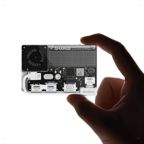 Hand holding All In One Portable 1TB SSD With Active Cooling Fan And Built In 4 Port Hub HDMI 2 1, magnetic external SSD