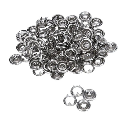 Close-up of nickel finish snap fasteners from Easy Press Snap Fastener Pliers Kit With 108 Snaps 3/16 Inch For Shirts Jeans Jackets Bags and Crafts Clean Finish Quick Install Centering Rubber Tips For Precise Placement.