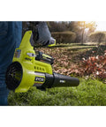 Heavy Duty Cordless Leaf Blower Pumping 110 Mph And 525 CFM With Variable Speed Settings for fast yard cleanup in use.