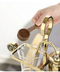 Killer Retro Glass Siphon Coffee Maker Smooth Siphon Brewer with Easy Clean Design, adding coffee grounds with a wooden scoop.