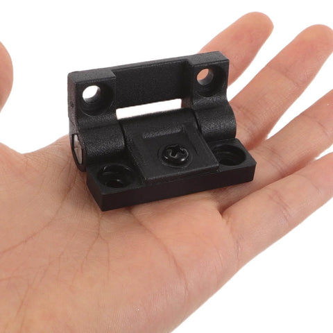 90 Degree Adjustable Torque Friction Door Hinge For Cabinets And Closets Built Tough Space Saving Plastic Cabinet Hinge shown in hand