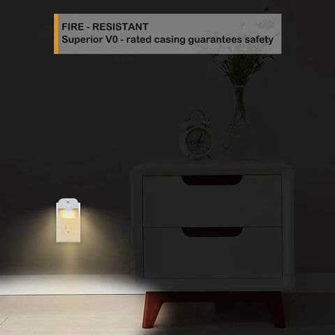 Glare Free Plug In LED Night Light With Dusk To Dawn Sensor next to bedside table, glow illuminating wall, fire resistant feature