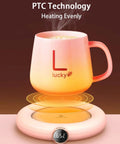 Keep Your Daily Brew Piping Hot On This Stylish Electric Coffee Mug Warmer Offering Three Custom Heat Levels Plus An Eight Hour Auto Shut Off Feature Tailored For Chill Home Or Hustling Office Environments. Pink mug on warmer displaying steam and 65°C.