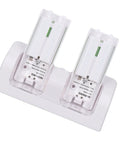 Dual Remote Charger Dock With Built In 2800mAh Batteries For Game Consoles And Smart TVs 4 In 1 Remote Charging Station Easy Drop In Recharge Without Battery Swaps Portable ABS Base In White Fast And Efficient Power showing overhead view of charging dock with batteries inserted