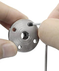 Close-up of hand holding a metal component from Rigid 8mm Flange Coupling Connector Set with hex wrench and screw for DIY RC models.