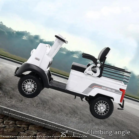 White 2-Passenger Electric Golf Cart Cruiser With Powerful 800W Motor Reaching 12 Mph Top Speed on a slope.