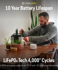 Yeti Portable Power Station 499 Watt Hour LiFePO4 Battery Water Resistant And Dustproof on table with man plugging in device