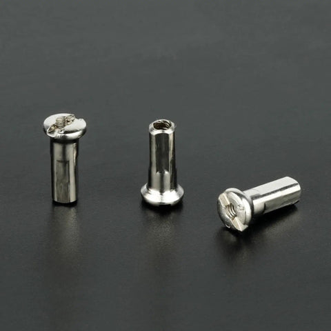 Three silver bike spoke nipples from 50 Pcs Pack Ultralight Steel Bike Spoke Nipples 12G 13G 14G In Black And Silver High Strength Wheel Spoke Nipples Caps Fits 2.0 To 2.6mm Spokes Great For Road And Mountain Bikes Adds Style And Protection on black background.