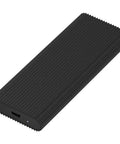 Totally Portable M2 Nvme Ssd Enclosure With Usb Type C External Case featuring a ribbed black aluminum design for cooling.