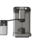 Level Up Your Daily Grind With This Fully Automatic Espresso Machine Featuring A Built In Grinder Dual Boiler Heating Premium Milk Frother And Smart Touch Panel For Six Quick Barista Shots In Sleek Gunmetal, showing brewing coffee and milk container.