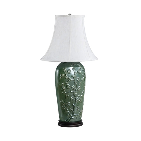 Green Glaze Floral Embossed Ceramic Table Lamp With Dark Wood Base, Traditional 33.5 Inch Height, Oval Bell Off White Linen Shade
